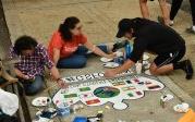 Students from the Global Student Friendship Center paint international flags on their crown. 图Chuck Thomas/ODU