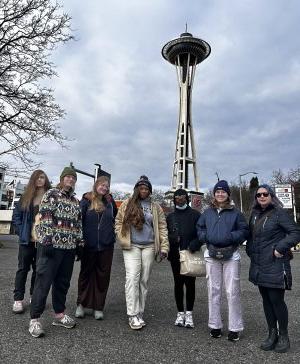 A group of ODU students stand in front of the space needle in Seattle.